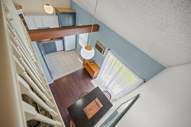 1 Abbott Rd Unit 32, Ellington, CT 06029 - staircase featuring vaulted ceiling, a textured ceiling, and wood finished floors