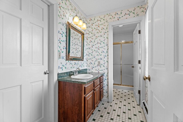 9 Academy Ln, Old Lyme, CT 06371 - bathroom featuring wallpapered walls, an enclosed shower, vanity, tile patterned floors, and crown molding