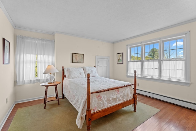 9 Academy Ln, Old Lyme, CT 06371 - bedroom with wood finished floors, crown molding, and baseboard heating