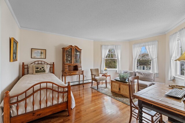 9 Academy Ln, Old Lyme, CT 06371 - bedroom with ornamental molding, a baseboard radiator, light wood finished floors, and a textured ceiling