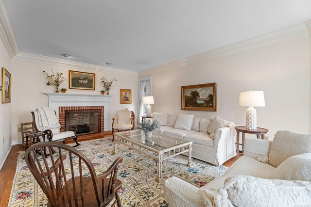 9 Academy Ln, Old Lyme, CT 06371 - living room featuring ornamental molding, a fireplace, wood finished floors, and baseboard heating