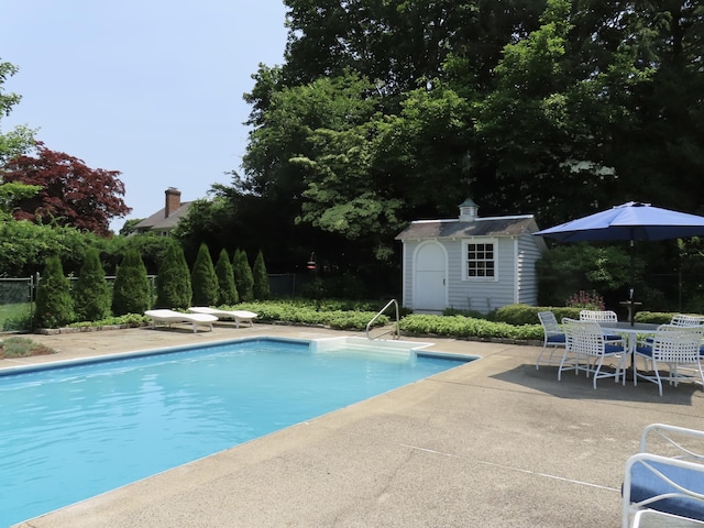 9 Academy Ln, Old Lyme, CT 06371 - view of swimming pool with a patio and a storage unit