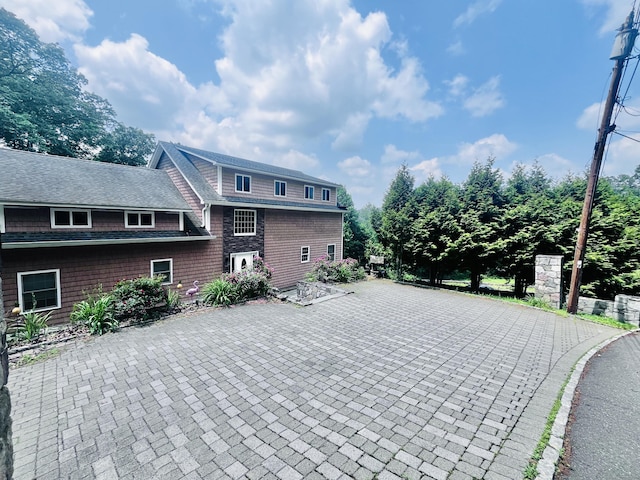 37 Fulton Dr, New Fairfield, CT 06812 - view of side of home with roof with shingles