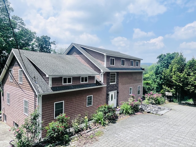 37 Fulton Dr, New Fairfield, CT 06812 - rear view of house with roof with shingles and a patio