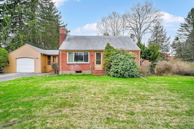 ranch-style house with a front yard, an attached garage, aphalt driveway, a chimney, and brick siding