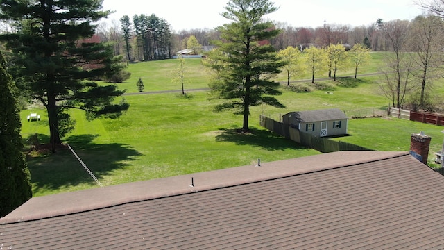 surrounding community featuring a yard and fence