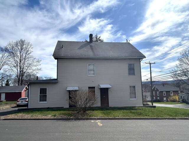 209 W Center St, Southington, CT 06489 - exterior space featuring a lawn and a chimney