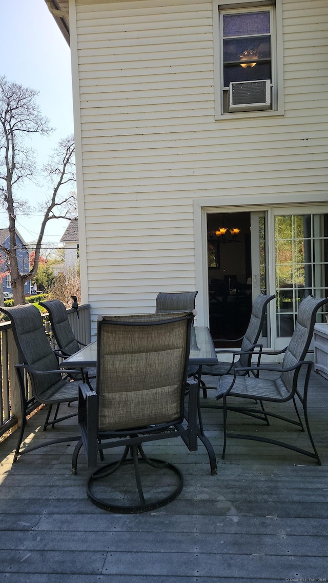 wooden deck featuring outdoor dining space