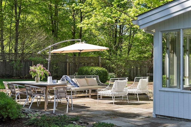 8 Twixt Rd, Cornwall, CT 06753 - fenced backyard with a patio area, outdoor lounge area, and outdoor dining area