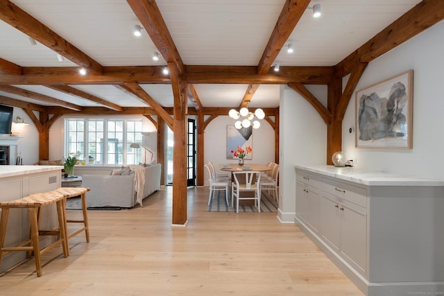 8 Twixt Rd, Cornwall, CT 06753 - dining space with a chandelier, beam ceiling, and light wood finished floors