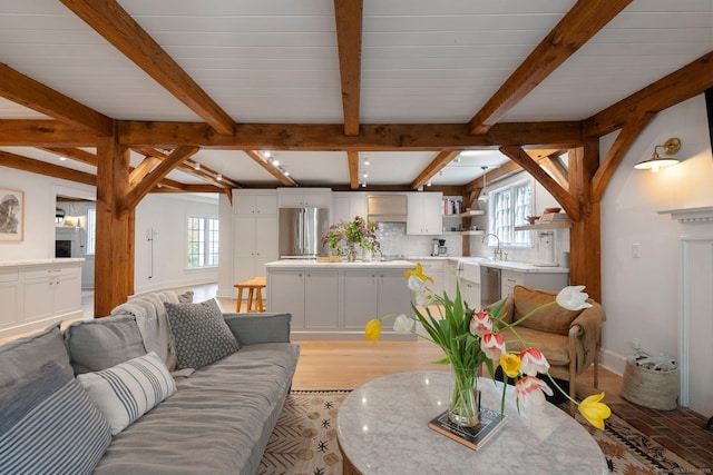 8 Twixt Rd, Cornwall, CT 06753 - living room featuring healthy amount of natural light, beamed ceiling, and light wood-type flooring