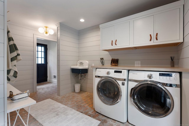 8 Twixt Rd, Cornwall, CT 06753 - laundry room with brick flooring, washing machine and dryer, recessed lighting, wood walls, and cabinet space
