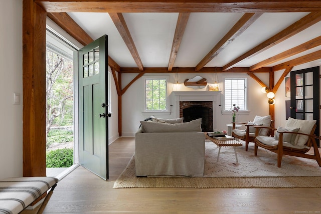 8 Twixt Rd, Cornwall, CT 06753 - living room with beam ceiling, plenty of natural light, wood finished floors, and a fireplace