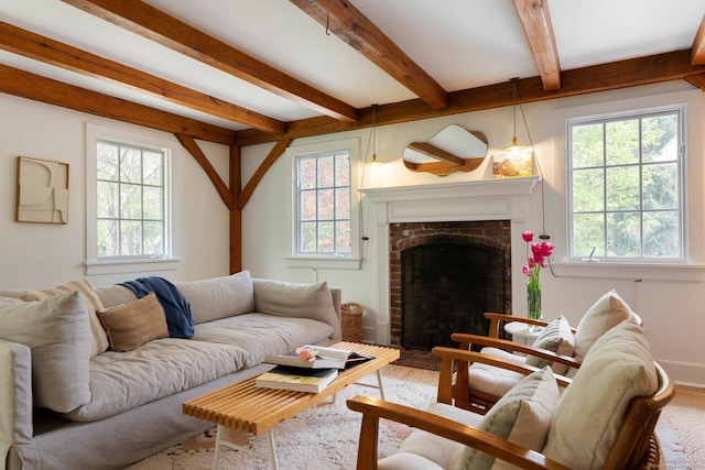 8 Twixt Rd, Cornwall, CT 06753 - living area with plenty of natural light, beamed ceiling, wood finished floors, a brick fireplace, and baseboards