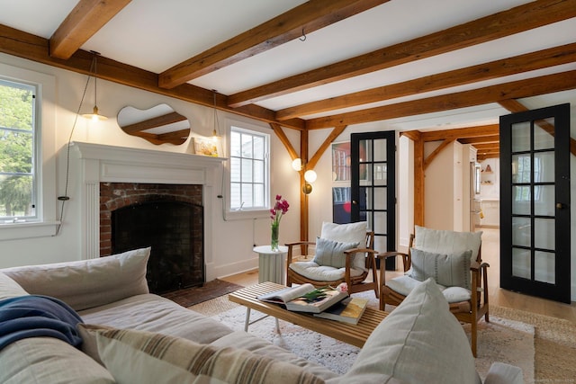8 Twixt Rd, Cornwall, CT 06753 - living area featuring wood finished floors, beamed ceiling, and a fireplace