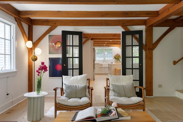 8 Twixt Rd, Cornwall, CT 06753 - sitting room with stairway, light wood-style flooring, beam ceiling, and baseboards