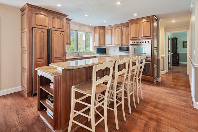 7 Tunxis Trl, Redding, CT 06896 - kitchen with crown molding, stainless steel appliances, light stone countertops, and a sink