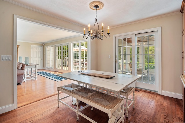 7 Tunxis Trl, Redding, CT 06896 - dining room with crown molding, baseboards, a notable chandelier, and hardwood / wood-style floors