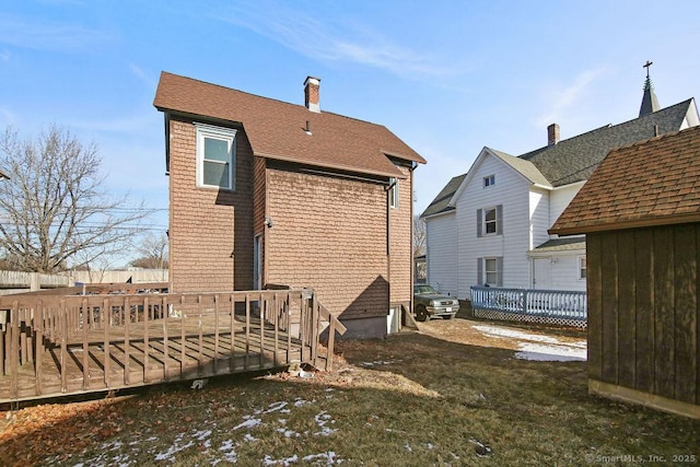 10 Silver St, Middletown, CT 06457 - rear view of house featuring a deck, a chimney, and roof with shingles