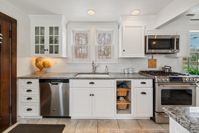 329 Weekeepeemee Rd, Woodbury, CT 06798 - kitchen with white cabinetry, stone countertops, appliances with stainless steel finishes, a sink, and decorative backsplash