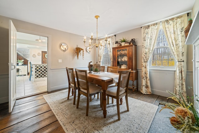 329 Weekeepeemee Rd, Woodbury, CT 06798 - dining room featuring a notable chandelier, wainscoting, and hardwood / wood-style flooring