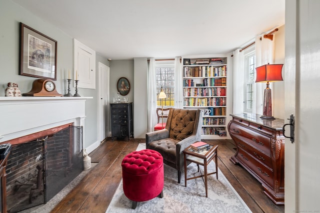 329 Weekeepeemee Rd, Woodbury, CT 06798 - living area with a fireplace with flush hearth, dark wood-type flooring, baseboards, and built in features