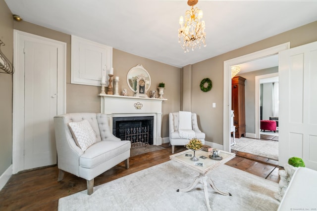 329 Weekeepeemee Rd, Woodbury, CT 06798 - living area with baseboards, a chandelier, wood finished floors, and a fireplace with flush hearth