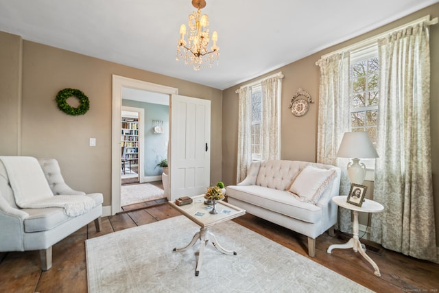 329 Weekeepeemee Rd, Woodbury, CT 06798 - living area featuring a wealth of natural light, wood-type flooring, baseboards, and an inviting chandelier