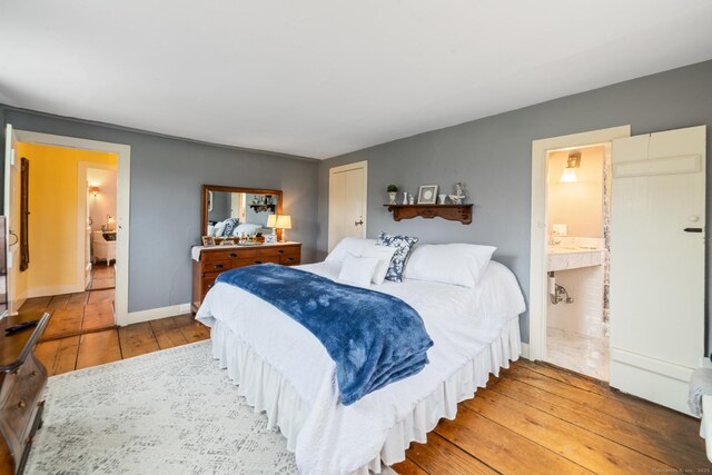 329 Weekeepeemee Rd, Woodbury, CT 06798 - bedroom featuring baseboards, connected bathroom, and hardwood / wood-style flooring