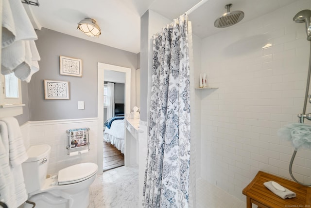 329 Weekeepeemee Rd, Woodbury, CT 06798 - ensuite bathroom featuring toilet, tile walls, a tile shower, and a wainscoted wall