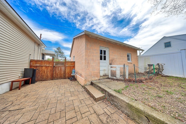 exterior space with fence and a gate