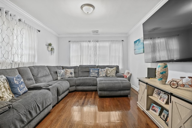 living area with visible vents, dark wood-style floors, and ornamental molding