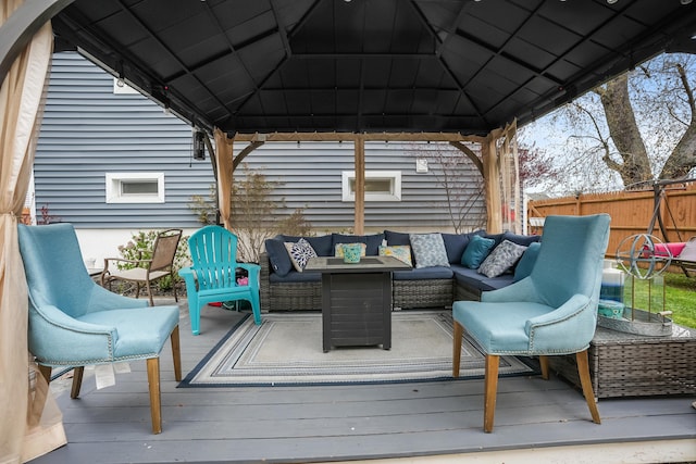 deck with fence, an outdoor hangout area, and a gazebo