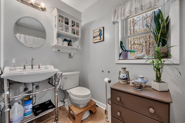98 Aetna Ave, Torrington, CT 06790 - full bathroom with toilet, baseboards, and a sink