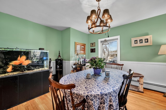 98 Aetna Ave, Torrington, CT 06790 - dining room with an inviting chandelier, light wood-style flooring, wainscoting, and baseboard heating