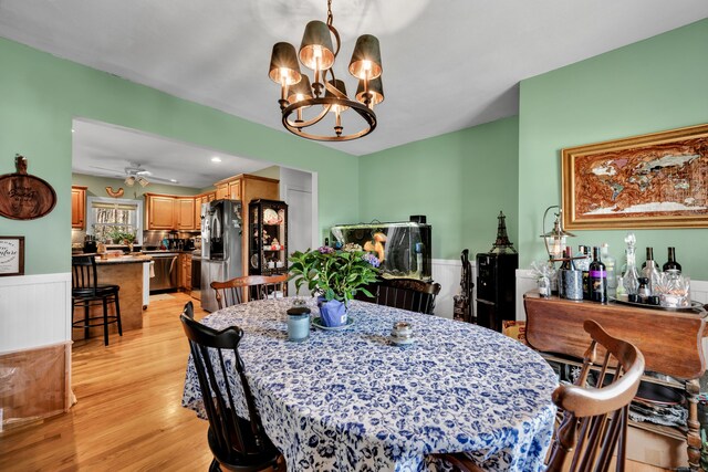 98 Aetna Ave, Torrington, CT 06790 - dining area featuring light wood finished floors and ceiling fan with notable chandelier