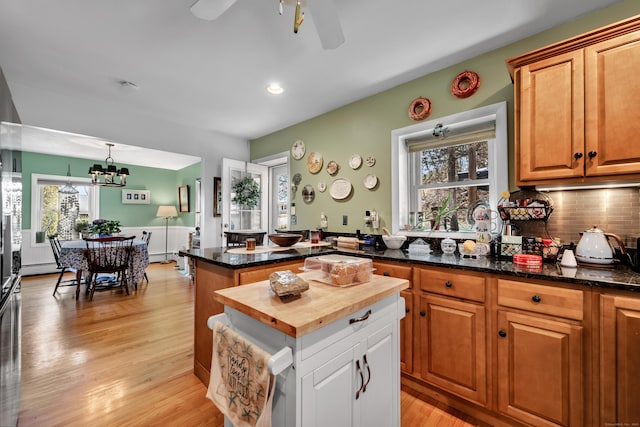 98 Aetna Ave, Torrington, CT 06790 - kitchen with a healthy amount of sunlight, light wood finished floors, wooden counters, and ceiling fan with notable chandelier