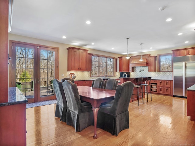 17 Fire Hill Ln, Redding, CT 06896 - dining space featuring light wood-style flooring, french doors, and recessed lighting