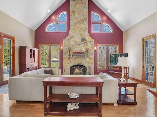 17 Fire Hill Ln, Redding, CT 06896 - living area with high vaulted ceiling, wood finished floors, a fireplace, and baseboards
