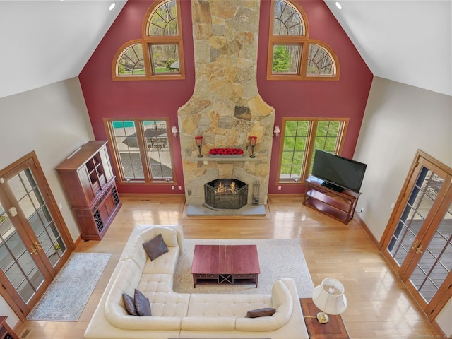 17 Fire Hill Ln, Redding, CT 06896 - living room with high vaulted ceiling, wood finished floors, a fireplace, and baseboards