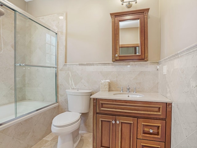 17 Fire Hill Ln, Redding, CT 06896 - full bathroom with tile walls, tiled shower / bath, toilet, vanity, and wainscoting