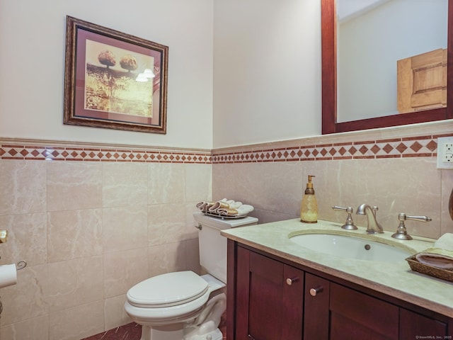 17 Fire Hill Ln, Redding, CT 06896 - bathroom featuring toilet, tile walls, vanity, and wainscoting