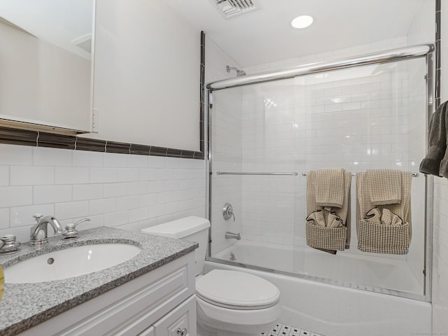 17 Fire Hill Ln, Redding, CT 06896 - full bath featuring shower / bath combination with glass door, toilet, tile walls, vanity, and recessed lighting