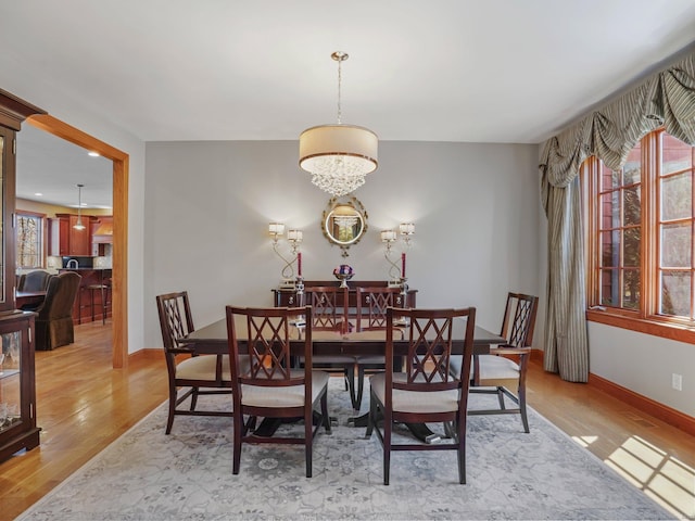 17 Fire Hill Ln, Redding, CT 06896 - dining room featuring light wood-style flooring, baseboards, and a chandelier