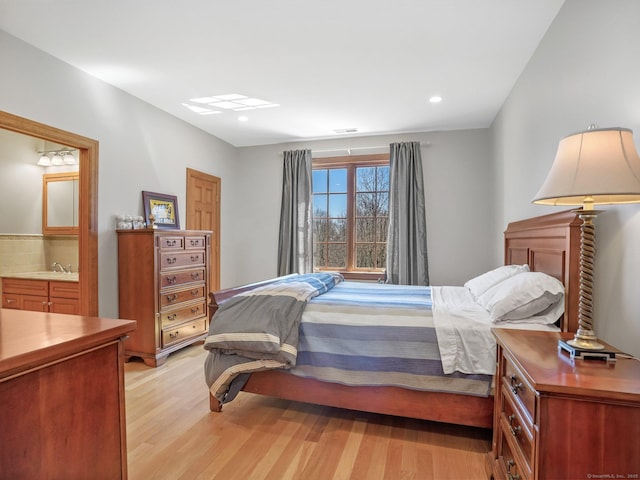 17 Fire Hill Ln, Redding, CT 06896 - bedroom featuring light wood finished floors, recessed lighting, a sink, and connected bathroom