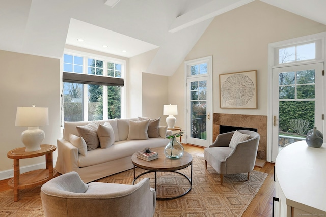 13 Bryan Rd, Norwalk, CT 06853 - living room featuring healthy amount of natural light, a fireplace, high vaulted ceiling, recessed lighting, and light wood finished floors