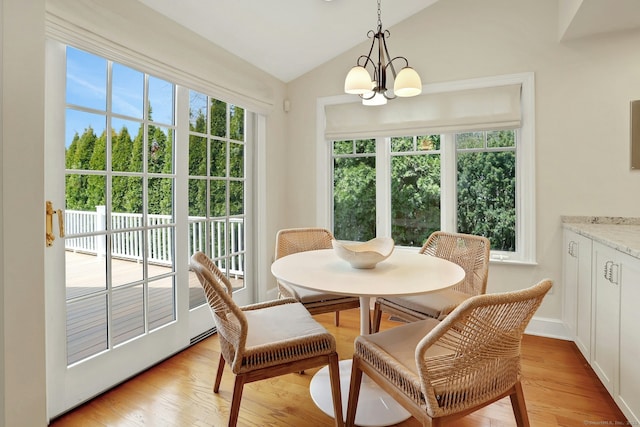 13 Bryan Rd, Norwalk, CT 06853 - dining area with vaulted ceiling, a chandelier, and light wood finished floors