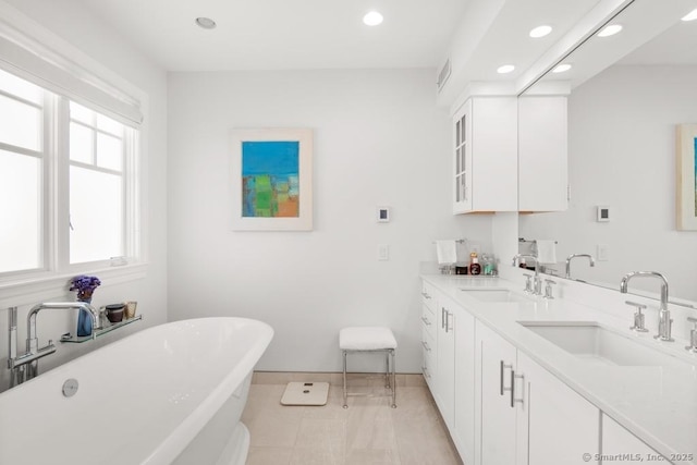 13 Bryan Rd, Norwalk, CT 06853 - bathroom featuring recessed lighting, a freestanding bath, baseboards, and double vanity