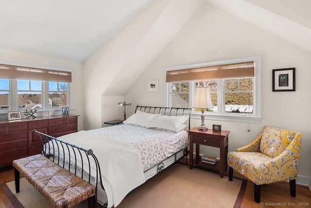 13 Bryan Rd, Norwalk, CT 06853 - bedroom with vaulted ceiling, wood finished floors, and multiple windows