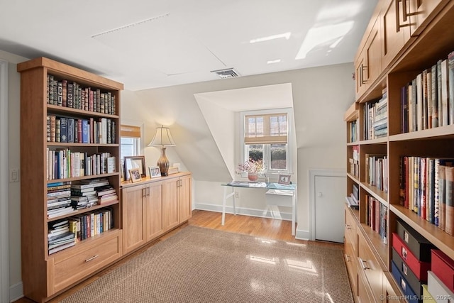 13 Bryan Rd, Norwalk, CT 06853 - living area with wood finished floors, bookshelves, and baseboards